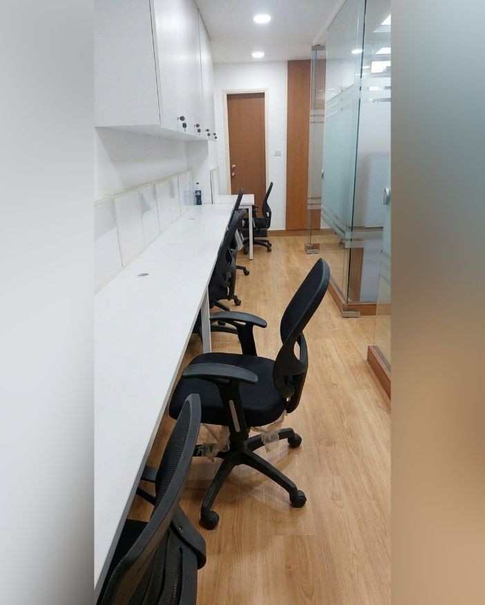 Row of workstations and chairs at the new office